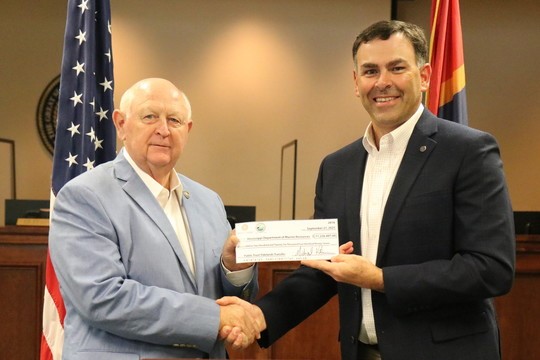 Secretary Watson presenting MDMR check